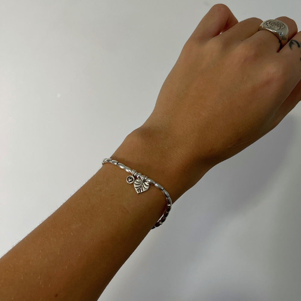 Join the Love Club with this adorable sterling silver beaded bracelet. Strung with delicate silver beads and two charming heart accents, this bracelet is sure to add a touch of love and style to any outfit. Whether you're feeling flirty or romantic, this bracelet has got you covered!