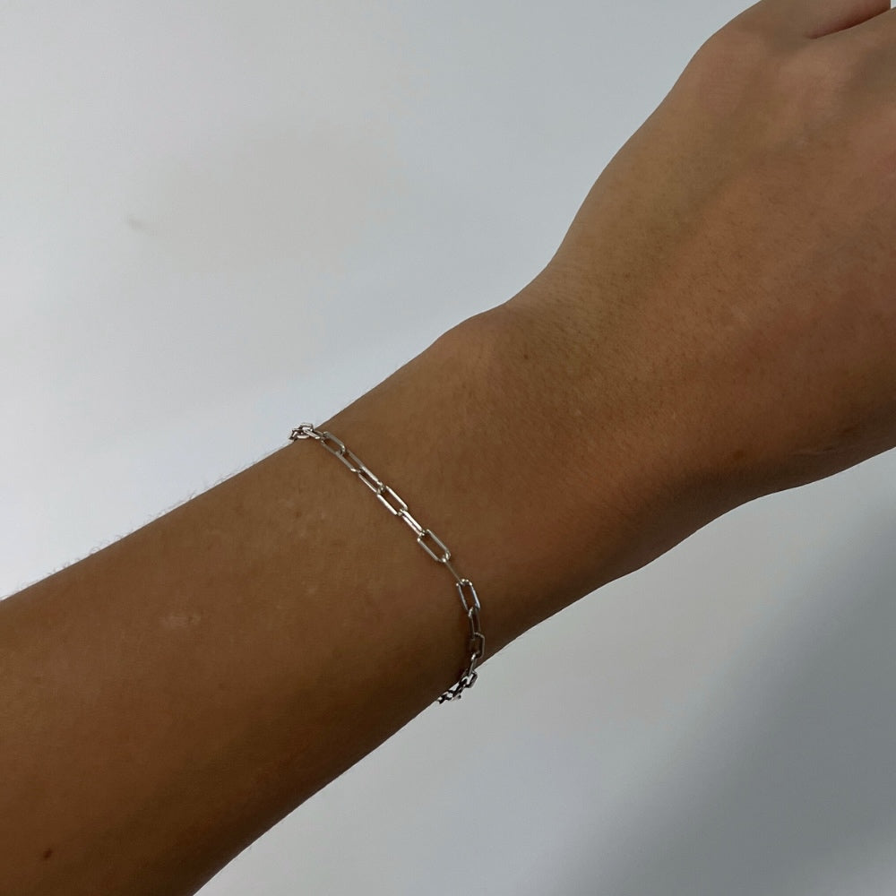 Experience elegance and sophistication with our Sterling Silver Bracelet. Adorned with a delicate Small Paperclip Chain, this bracelet is the perfect addition to any outfit. Made from high-quality sterling silver, it exudes luxury and style. Elevate your jewellery collection today and make a statement with this stunning bracelet.