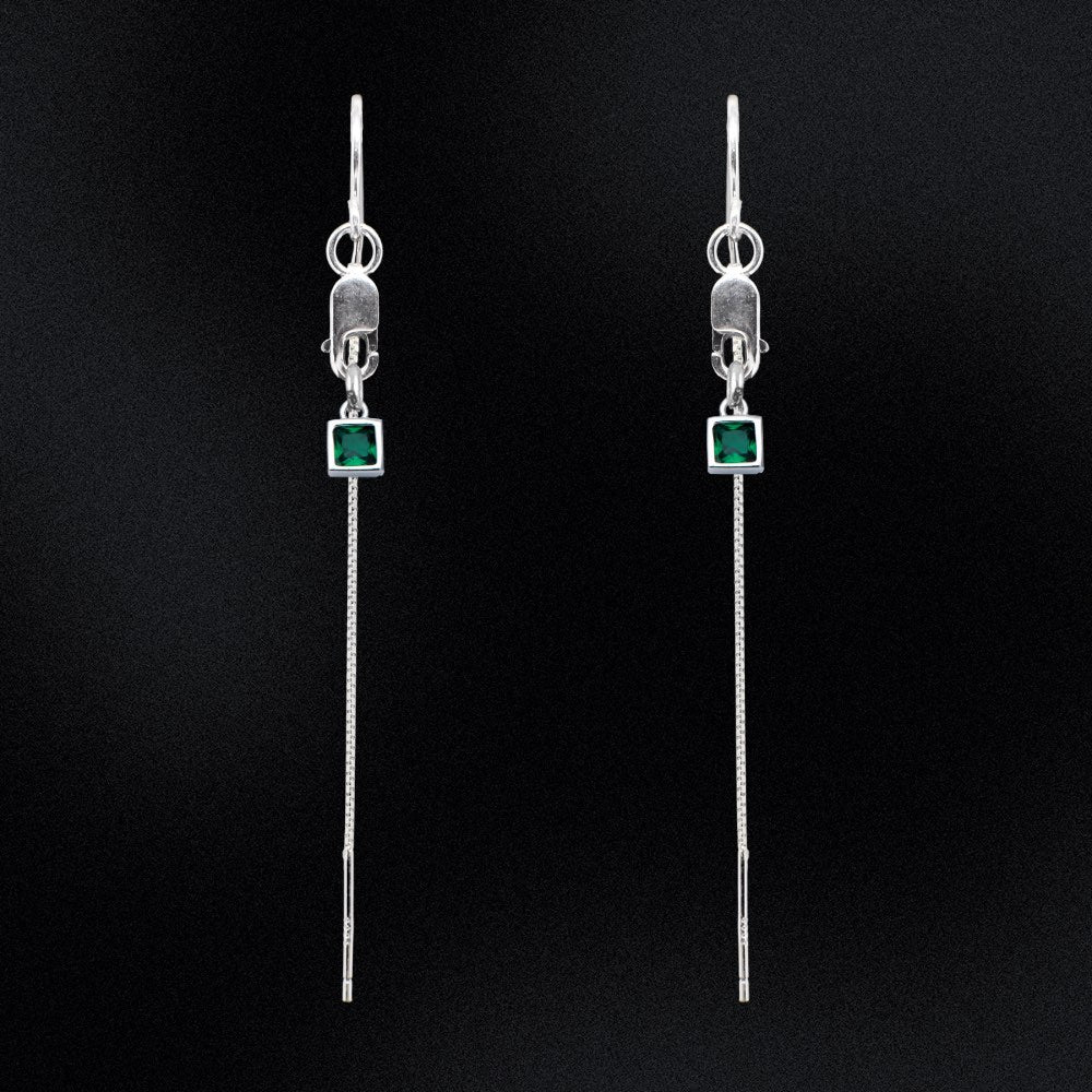Introducing our Evergreen Thread Earrings! These gorgeous earrings feature delicate threads that dangle from a sleek and secure lobster clasp, adding a touch of elegance to any outfit. The earrings are adorned with a beautiful green square charm, adding a pop of colour that is sure to turn heads.