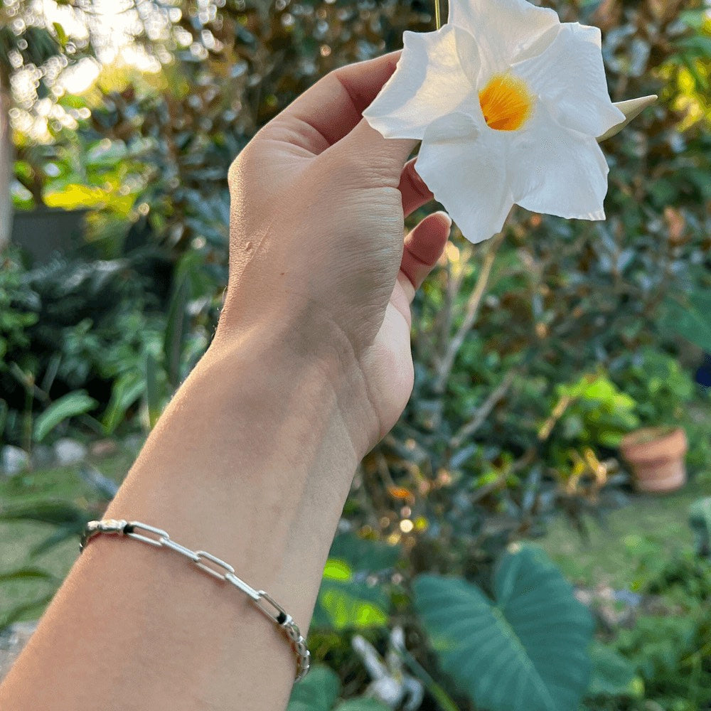 The ultimate fashion statement that effortlessly elevates any outfit! Handcrafted to perfection, this bracelet boasts of delicate sterling silver beads that beautifully sit around your wrist, giving you an exquisite and timeless look.