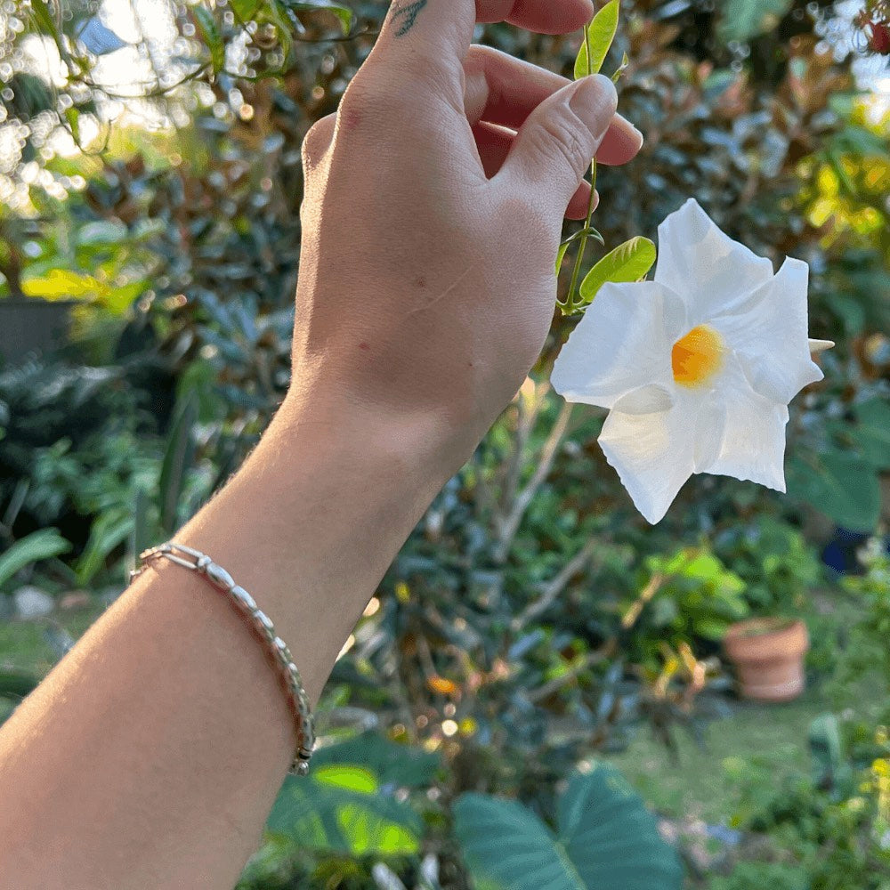 The ultimate fashion statement that effortlessly elevates any outfit! Handcrafted to perfection, this bracelet boasts of delicate sterling silver beads that beautifully sit around your wrist, giving you an exquisite and timeless look.