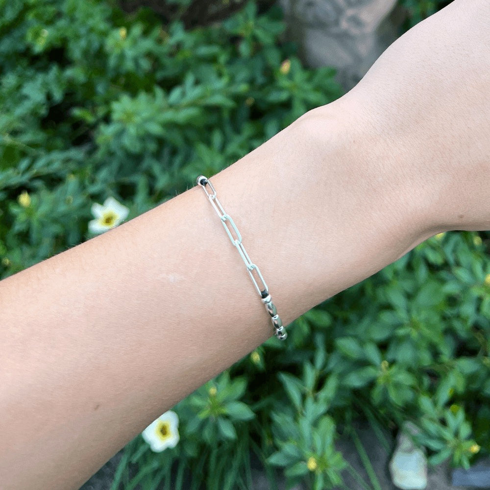 The ultimate fashion statement that effortlessly elevates any outfit! Handcrafted to perfection, this bracelet boasts of delicate sterling silver beads that beautifully sit around your wrist, giving you an exquisite and timeless look.